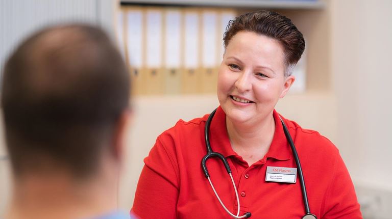 employee interviewing a donor